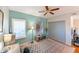 Inviting bedroom featuring a ceiling fan, a window with shutters, and stylish decorative accents at 8350 Savannah Trace Cir # 1808, Tampa, FL 33615