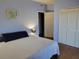 Cozy bedroom with comfortable bedding and a view into a closet and the entry door at 8350 Savannah Trace Cir # 1808, Tampa, FL 33615