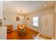 Dining room features hardwood floors, a bright window, and access to the entry door at 8350 Savannah Trace Cir # 1808, Tampa, FL 33615
