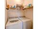 Laundry room with washer and dryer hookups and wire shelving for storage at 8350 Savannah Trace Cir # 1808, Tampa, FL 33615