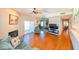 Spacious living room with hardwood floors, a fireplace, and sliding doors leading to a balcony, offering a bright and inviting space at 8350 Savannah Trace Cir # 1808, Tampa, FL 33615