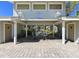 A covered seating area with pool rules, tables, and restrooms provides a relaxing community space at 8350 Savannah Trace Cir # 1808, Tampa, FL 33615