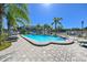 A sparkling community pool with plenty of lounge chairs provides a perfect retreat at 8350 Savannah Trace Cir # 1808, Tampa, FL 33615