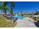 A sunny community pool with lounge chairs offers a relaxing spot for residents at 8350 Savannah Trace Cir # 1808, Tampa, FL 33615