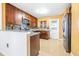 Modern kitchen with stainless steel appliances, dark wood cabinets and granite countertops at 8544 Lazy River Dr, Tampa, FL 33617