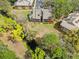Aerial view of complex building surrounded by mature trees and green space at 9100 Dr Martin Luther King Jr N St # 1508, St Petersburg, FL 33702