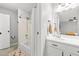 Well-lit bathroom with shower and tub combination and decor rug at 9100 Dr Martin Luther King Jr N St # 1508, St Petersburg, FL 33702