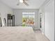 Cozy bedroom with a large window, lots of plants and natural light, plus a view of the exterior at 9100 Dr Martin Luther King Jr N St # 1508, St Petersburg, FL 33702