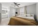 Comfortable bedroom featuring a ceiling fan, bed, and ensuite bathroom at 9100 Dr Martin Luther King Jr N St # 1508, St Petersburg, FL 33702