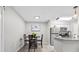 Dining area, stainless appliances, with seating at a table in front of the kitchen at 9100 Dr Martin Luther King Jr N St # 1508, St Petersburg, FL 33702
