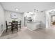 Cozy dining area with a modern chandelier, stainless steel appliances, and an open concept design at 9100 Dr Martin Luther King Jr N St # 1508, St Petersburg, FL 33702