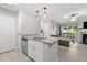 Beautiful kitchen with granite countertops, stainless steel appliances, and a view into the living room at 9100 Dr Martin Luther King Jr N St # 1508, St Petersburg, FL 33702