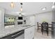 Bright kitchen featuring granite countertops, stainless steel appliances, and an open layout at 9100 Dr Martin Luther King Jr N St # 1508, St Petersburg, FL 33702