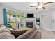 Comfortable living room with a fireplace, ceiling fan, and a view to the exterior at 9100 Dr Martin Luther King Jr N St # 1508, St Petersburg, FL 33702