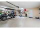 Spacious garage with epoxy flooring, offering ample space for parking and storage with room for a golf cart at 102 Adriatic Ave, Tampa, FL 33606