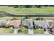 Single Gathering home aerial view with mature landscaping and water view at 10237 Collar Dr, San Antonio, FL 33576