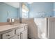 Bathroom featuring walk-in sink, and walk-in jacuzzi tub with safety grab bars at 10237 Collar Dr, San Antonio, FL 33576