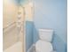 Bathroom featuring walk-in shower and handicap grab bars at 10237 Collar Dr, San Antonio, FL 33576