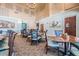 A charming dining room features soaring ceilings, a chandelier, and comfortable seating at 10237 Collar Dr, San Antonio, FL 33576
