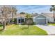 Charming single Gathering home with mature landscaping and a two car garage at 10237 Collar Dr, San Antonio, FL 33576