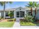 Front of home with lovely landscaping and charming decor at 10237 Collar Dr, San Antonio, FL 33576