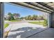 View from the garage showing the driveway and quiet neighborhood street at 10237 Collar Dr, San Antonio, FL 33576