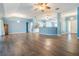 Open-concept living space with stylish floors seamlessly connecting to the kitchen at 10237 Collar Dr, San Antonio, FL 33576