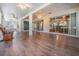 Spacious sunroom with stylish flooring, ceiling fans, and tranquil outdoor views at 10237 Collar Dr, San Antonio, FL 33576