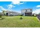 Fenced backyard offering ample green space and privacy, perfect for outdoor activities and relaxation at 10432 High Noon Trl, Parrish, FL 34219