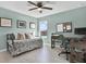 Bedroom featuring a daybed, desk, and large window with a view at 10432 High Noon Trl, Parrish, FL 34219