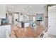 Open concept kitchen with island, stainless steel appliances, granite countertops, and tile flooring at 10432 High Noon Trl, Parrish, FL 34219