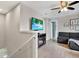 Cozy living room area featuring a flatscreen TV and comfortable seating at 10432 High Noon Trl, Parrish, FL 34219