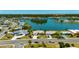 Aerial view of a waterfront community featuring beautiful homes and lush landscaping at 1504 Valley Forge Blvd, Sun City Center, FL 33573