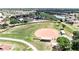 Aerial view of a well-maintained baseball field with a covered dugout at 1504 Valley Forge Blvd, Sun City Center, FL 33573
