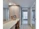 Bathroom with vanity, a large mirror, and doorway leading to another bathroom at 1504 Valley Forge Blvd, Sun City Center, FL 33573