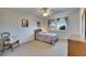 Well-lit bedroom featuring neutral walls, carpet, and a charming floral bedspread at 1504 Valley Forge Blvd, Sun City Center, FL 33573