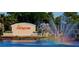 Signage for Sun City Center with fountain and lush greenery at 1504 Valley Forge Blvd, Sun City Center, FL 33573