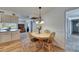 Charming dining room boasts a chandelier and is adjacent to kitchen and other living spaces at 1504 Valley Forge Blvd, Sun City Center, FL 33573