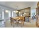 Bright dining area with wooden furniture, mirrored wall and a view of the adjacent room at 1504 Valley Forge Blvd, Sun City Center, FL 33573
