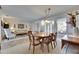 Dining area with wooden table and chairs, open to the living room, creating a welcoming and connected space at 1504 Valley Forge Blvd, Sun City Center, FL 33573