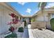 Charming courtyard entry, beautifully landscaped with stone walkway at 1504 Valley Forge Blvd, Sun City Center, FL 33573