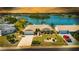 Charming single-story home boasts lush landscaping, a two-car garage, and serene water views at 1504 Valley Forge Blvd, Sun City Center, FL 33573