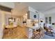 Open kitchen with breakfast bar, wood floors, and seamless flow to dining area at 1504 Valley Forge Blvd, Sun City Center, FL 33573