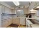 Well-lit kitchen with stainless steel appliances, and modern cabinets at 1504 Valley Forge Blvd, Sun City Center, FL 33573