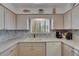 Bright kitchen with appliances, ample cabinetry, and a cozy breakfast area at 1504 Valley Forge Blvd, Sun City Center, FL 33573