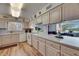 Bright kitchen features modern appliances, countertops, and a scenic water view at 1504 Valley Forge Blvd, Sun City Center, FL 33573