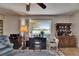 Cozy living room features a desk with a water view, ceiling fan, and wood accents at 1504 Valley Forge Blvd, Sun City Center, FL 33573