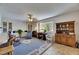 Living room with an open floor plan, built-in cabinets, natural light, and an adjacent kitchen at 1504 Valley Forge Blvd, Sun City Center, FL 33573