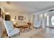Cozy living room featuring floral sofa and armchairs, complemented by neutral walls and flooring at 1504 Valley Forge Blvd, Sun City Center, FL 33573