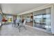 Outdoor patio with a table and chairs, accessible through sliding glass doors from the living room at 1504 Valley Forge Blvd, Sun City Center, FL 33573